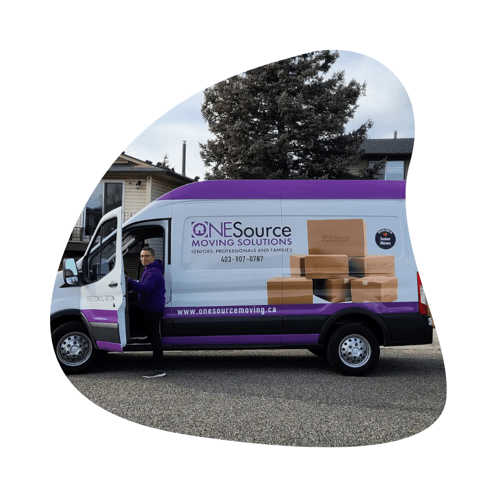 ONESource Moving Solutions van parked on a Calgary residential street during a senior downsizing project.