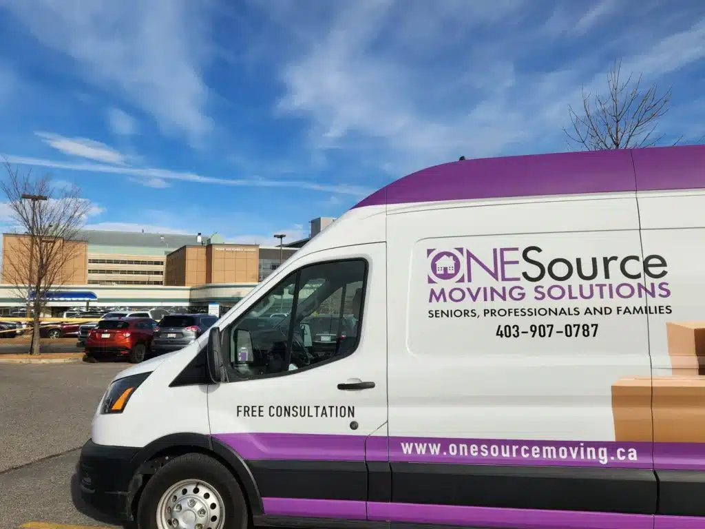 ONESource Moving Solutions van parked at the Peter Lougheed Centre in Calgary NE, highlighting senior downsizing and hospital-to-home transition support.